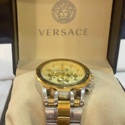 A bold statement piece, this Versace chronograph watch features a gold dial with chronograph subdials, housed in a two-tone stainless steel case and bracelet.