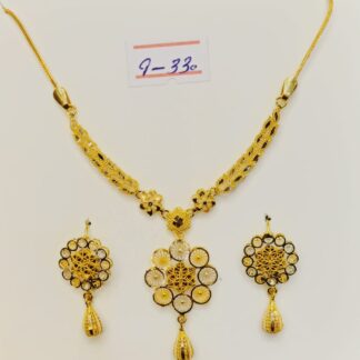 This captivating necklace and earring set features a blossoming flower design, meticulously crafted from luxurious 21k gold filigree