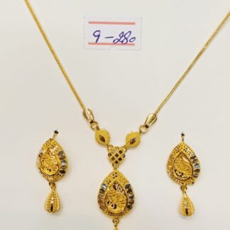 This captivating necklace and earring set features a swirling paisley design, meticulously crafted from luxurious 21k gold.