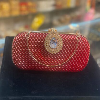 Red Clutch with a Diamond Brooch