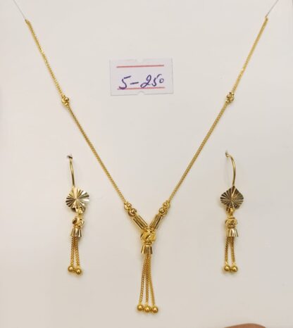 Add a touch of sophistication to any outfit with this classic 21k yellow gold ball necklace and stud earring set.