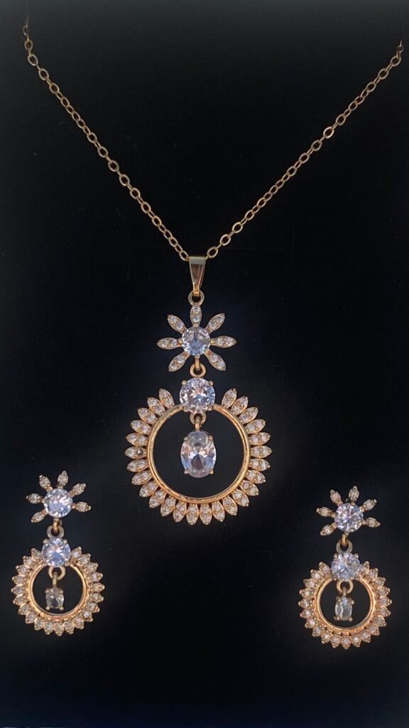 This pear-shaped pendant set shimmers with a moonstone center and dazzling cubic zirconia accents.