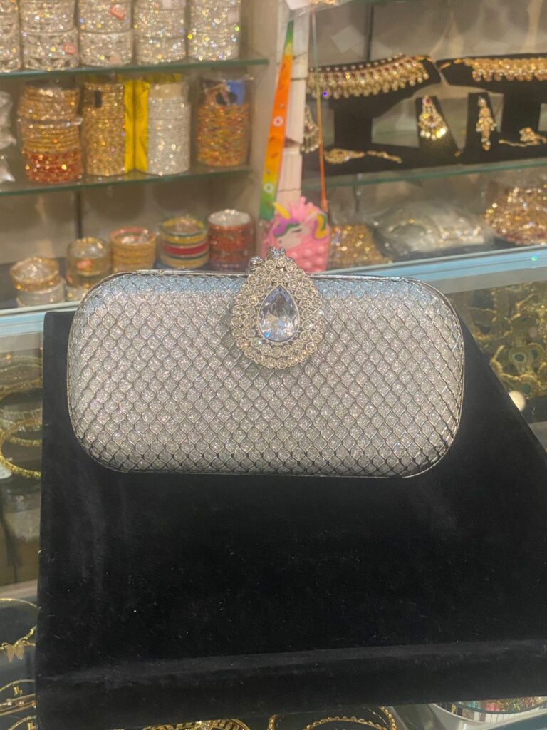 Silver Evening Clutch with Embellished Brooch