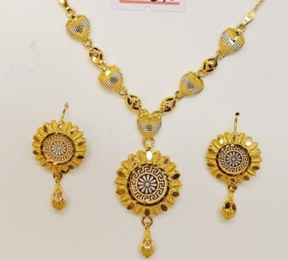 Elevate your look with this luxurious 21K gold necklace and earring set. The necklace features a stunning Versace pattern pendant, complemented by a pair of matching earrings.