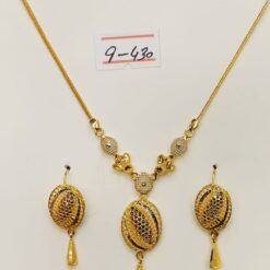 Own the night with the dazzling elegance of this 21ct gold Soiree necklace and earring set, perfect for making a grand entrance at any soiree.