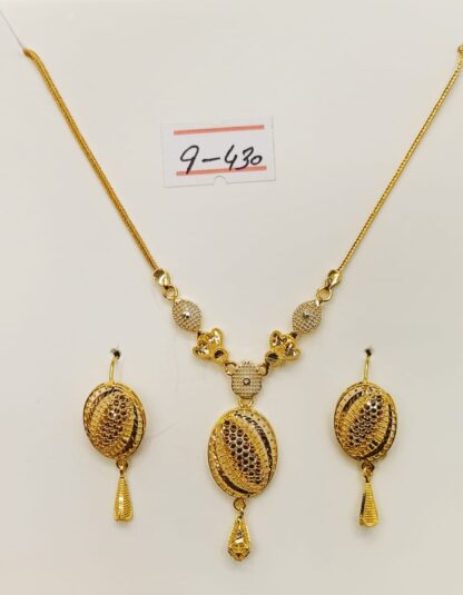 Own the night with the dazzling elegance of this 21ct gold Soiree necklace and earring set, perfect for making a grand entrance at any soiree.