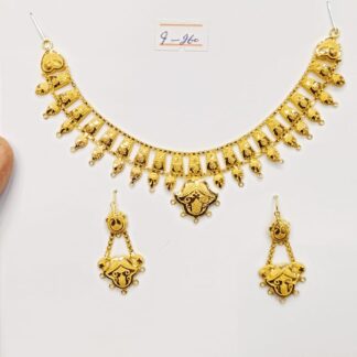 This elegant gold necklace and earring set features a curved leaf design with a polished finish.