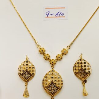 This 21K gold necklace and earring set features a mesmerizing lacework design, adding a touch of intricate elegance to any outfit.