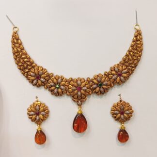 An exquisite 21K gold Madrasi choker necklace set adorned with vibrant multicolored stones and amber teardrop pendants, paired with matching earrings.