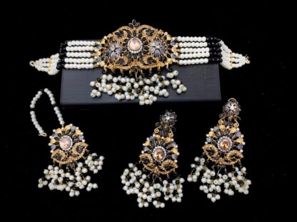 Traditional bridal choker set in black and gold with Kundan detailing, pearl beads, earrings, and maang tikka – Carat Vogue ethnic jewelry