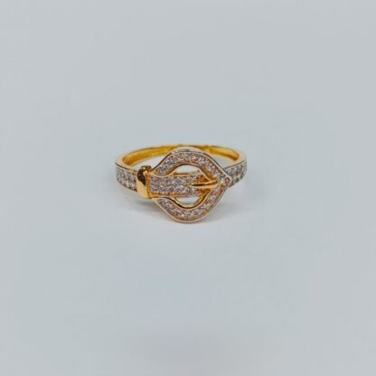 Statement 21K gold ring with round clustered stone centerpiece and polished band