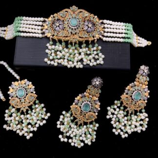 Fresh mint green choker necklace with gold Kundan, pearl drops, earrings, and maang tikka – perfect for haldi or mehndi functions – Carat Vogue