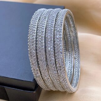 Classic Silver Plated AD Stone Pave Bangle Set Classic Silver Plated AD Stone Pave Bangle Set with Micro-Pave American Diamond Stones by Carat Vogue