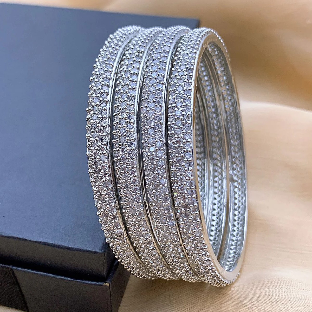 Classic Silver Plated AD Stone Pave Bangle Set Classic Silver Plated AD Stone Pave Bangle Set with Micro-Pave American Diamond Stones by Carat Vogue