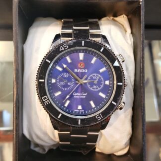 Shop the iconic Rado-inspired Captain Cook blue dial watch. Features a professional rotating bezel, dual sub-dials, and a durable silver stainless steel band. The perfect vintage-style diver's watch for any collection.