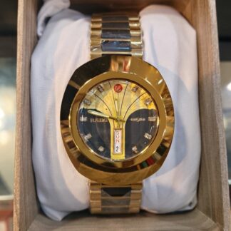 Shop the iconic Rado-inspired DiaStar gold-tone watch. Featuring a unique scratch-resistant look, crystal indices, and vertical day-date display. The ultimate vintage-style luxury watch for men.