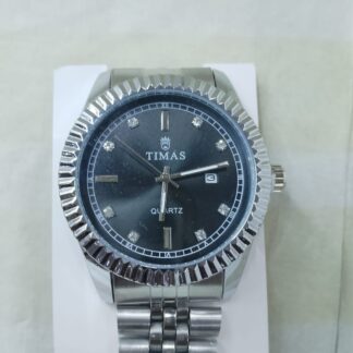 Timas quartz watch with a silver-colored fluted bezel and a black dial with rhinestone hour markers.
