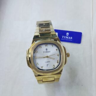 A gold-tone TIMAS Prestige watch with a unique octagonal case, a textured white dial featuring gold Arabic numeral hour markers, and an integrated gold-plated bracelet.