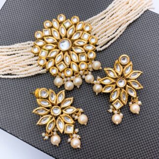 Handcrafted bridal wedding jewelry set featuring a combined pattern of multi-strand seed pearls and a brilliant-cut American Diamond medallion in a silver-toned rhodium finish.