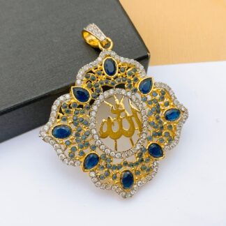 A majestic sapphire blue Allah calligraphy pendant with gold script, featuring an ornate scalloped border set with blue crystals and brilliant white diamonds.