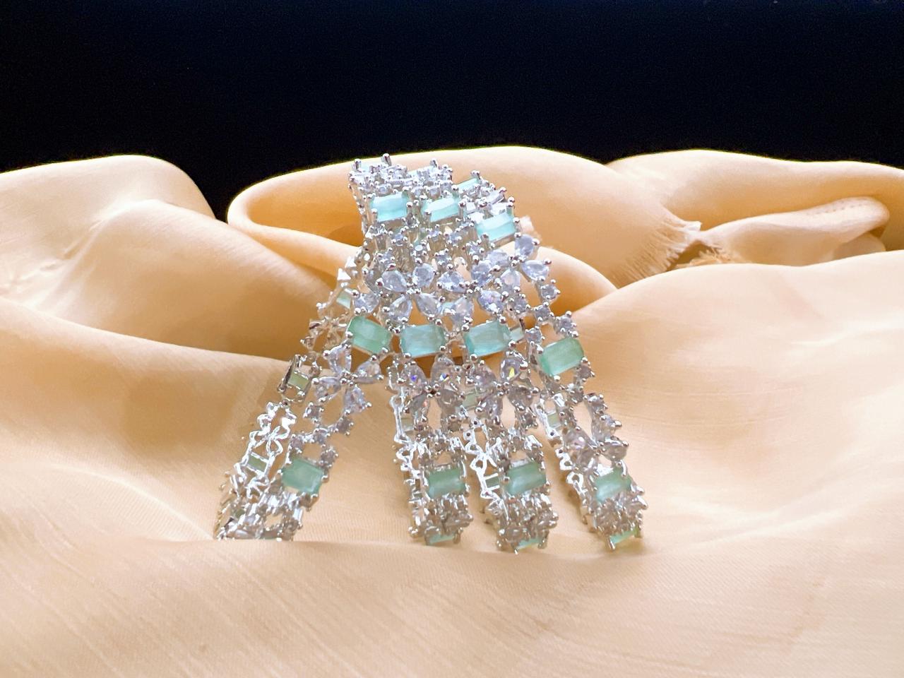 Mint green American Diamond AD bangles set in silver finish for women in Australia featuring rectangular green stones and clear cubic zirconia accents for festive and party wear. Premium American Diamond bangles set designed for customers in Australia. Featuring mint green rectangular stones and silver tone finish with sparkling AD accents, ideal for celebrations, weddings, and stylish evening events.