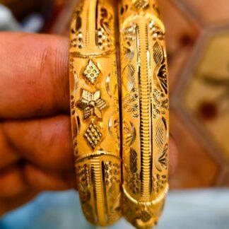 Stunning 16g pair of solid 22K gold bridal bangles. Handcrafted star-motif filigree in premium 916 gold. Investment-grade wedding jewelry.