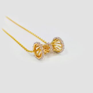 A contemporary 22k gold barrel pendant featuring a unique spiral drum design with zirconia-encrusted rings. Handcrafted by master goldsmiths with a certified 916 finesse, this 7.5g piece represents the high-purity standards of Waqar Irfan Jewellers.