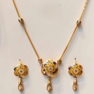 Luxury 22k solid gold jewellery set displaying a detailed multi-layered tiered floral dome pendant necklace and matching drop earrings on a white background.