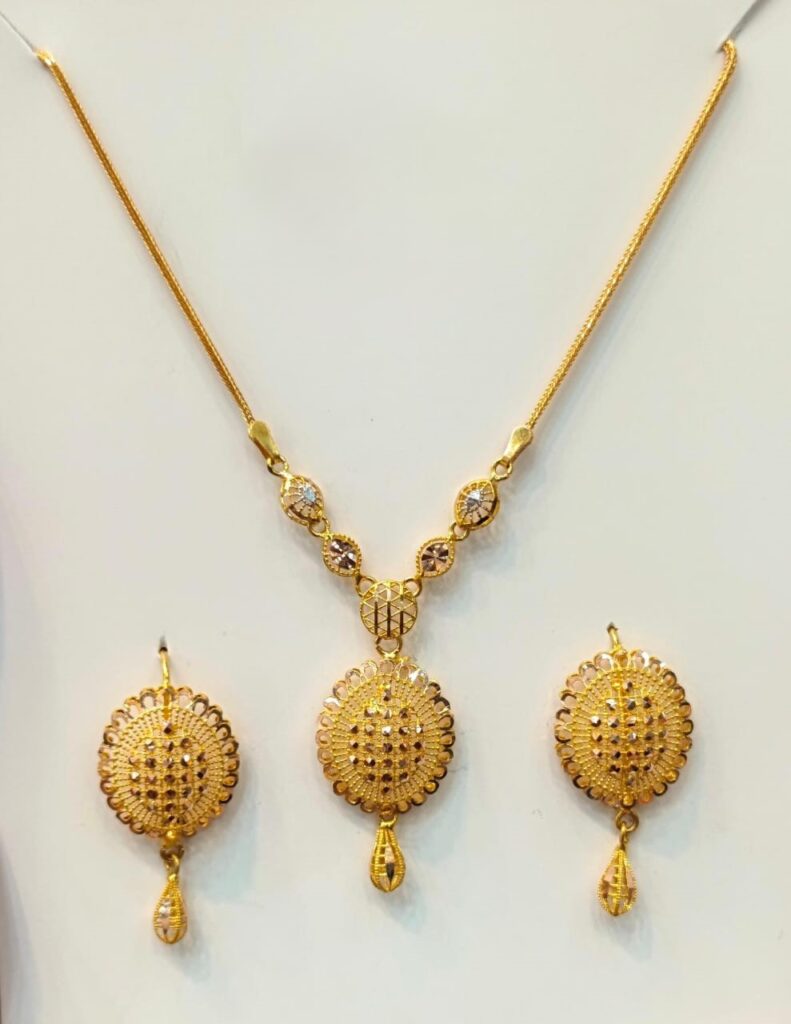 Shop a distinctive 22K gold lattice medallion necklace and matching drop earrings. Traditional-inspired yellow gold jewelry designed for weddings, bridal events and special occasions.