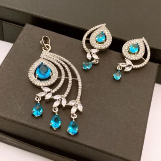 Blue and clear cubic zirconia peacock tail pendant necklace and matching drop earrings set