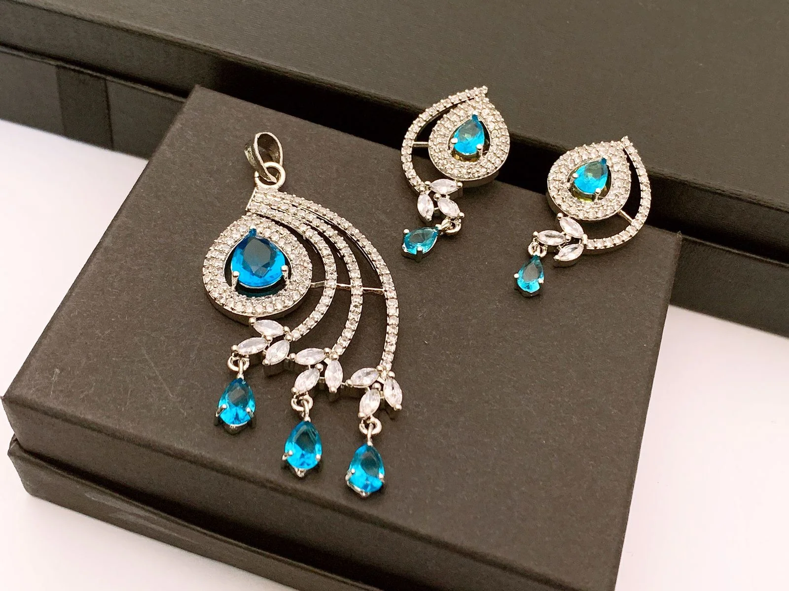 Blue and Clear Cubic Zirconia Peacock Tail Pendant Necklace & Earrings Set Blue and clear cubic zirconia peacock tail pendant necklace and matching drop earrings set