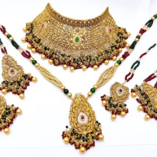 Traditional antique gold Kundan bridal jewelry set with choker necklace, rani haar, and earrings