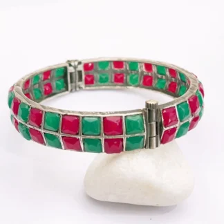 Shop the Vibrant Miami Red & Green Mosaic Statement Bangle featuring colorful geometric stones, a silver-tone finish and hinged clasp design.