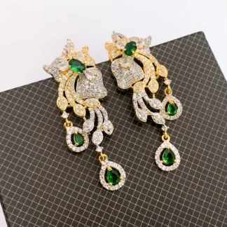 American emerald and diamond chandelier drop earrings featuring green and clear cubic zirconia